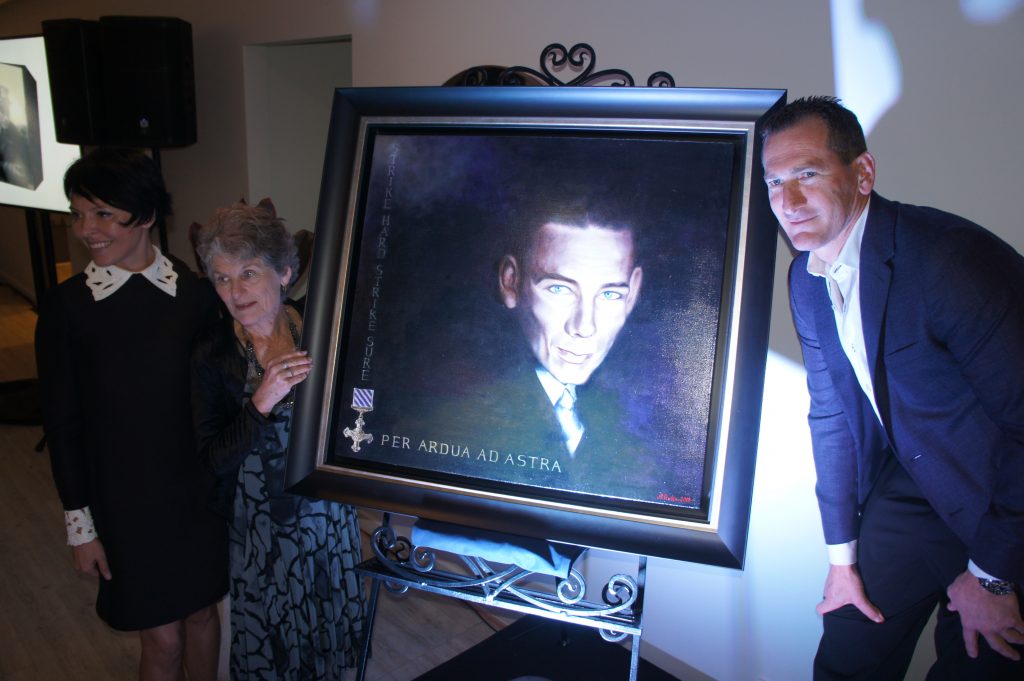 Travis Schultz and his mum, Denise, unveils an artwork of Jack O'Brien by international artist Anna Rubin to mark the launch of Travis Schultz Law. 
