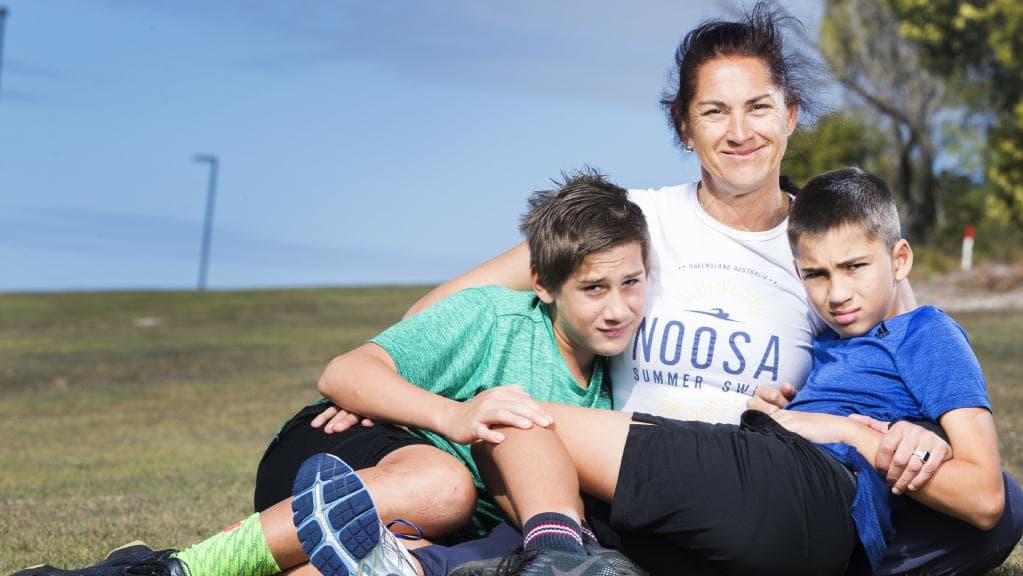 Dr Sally James, with twin sons Charlie and Oscar, 12, was injured during a triathlon.