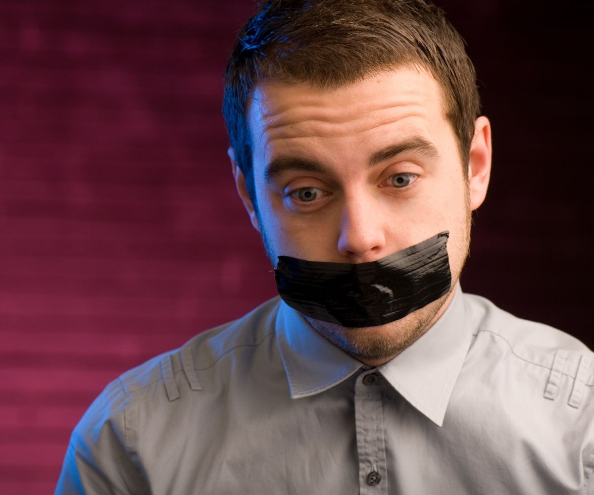 Man with mouth taped