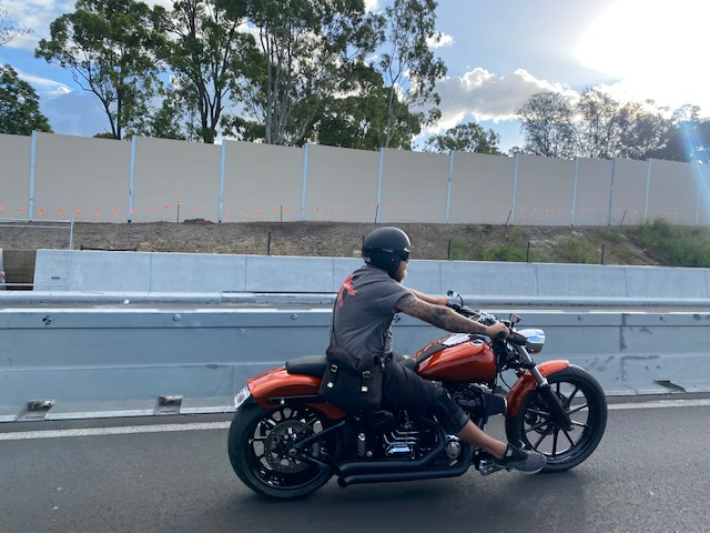 Man riding motorcycle on highway